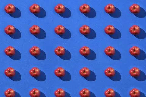 Pattern of red apples on a blue background Stock Photos