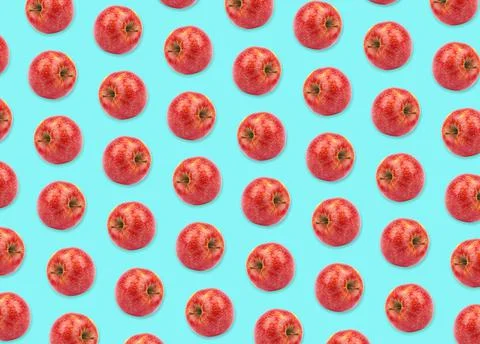 Pattern of red apples on light blue background Stock Photos