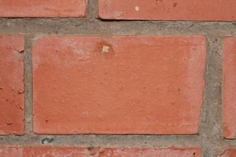 Pattern of red brick and cement texture as part of a wall frame close-up 스톡 사진