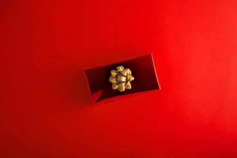 Pattern Red gift box with golden ribbon on red background. Christmas, New Y.. Stock Photos