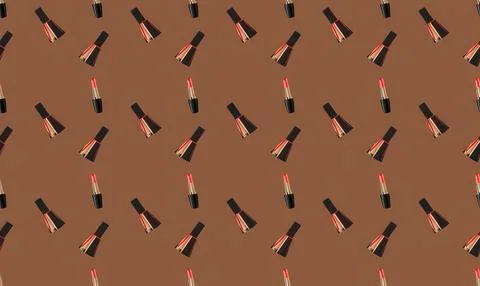 Pattern of red lipstick tubes on brown background Иллюстрация