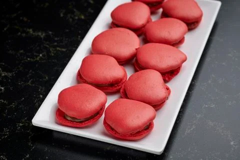 Pattern of red Macaroons on a white rectangular plate Stock Photos
