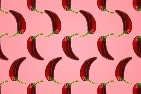 Pattern of red peppers isolated on pink background. Stock Photos