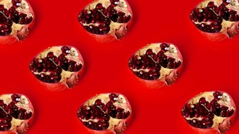 Pattern of red pomegranates in rows on red background, fruit lines backdrop Stock Photos