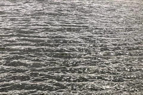 Pattern of reflection of sun in waves Stock Photos