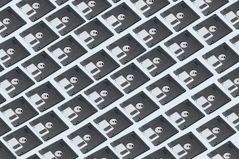 Pattern of retro floppy disks on blue table Stock Photos