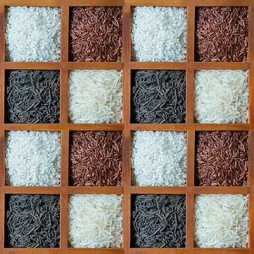 Pattern of rice white and red in wooden cells background culinary Stock Photos