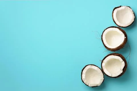 Pattern with ripe coconuts on blue background. Top View. Copy Space. Pop art Stock Photos