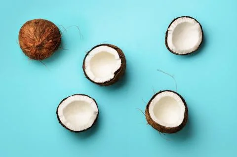 Pattern with ripe coconuts on blue background. Top View. Copy Space. Pop art Foto stock