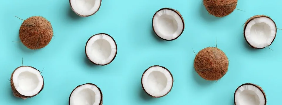 Pattern with ripe coconuts on blue background. Pop art design, creative summer Stock Photos