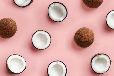 Pattern with ripe coconuts on pink background. Top View. Copy Space. Pop art Foto stock