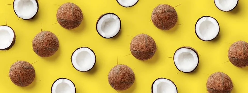 Pattern with ripe coconuts on yellow background. Pop art design, creative summer Foto stock