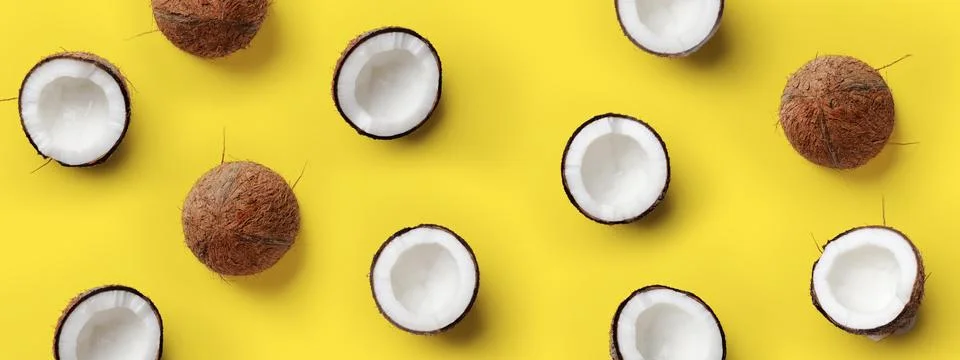 Pattern with ripe coconuts on yellow background. Pop art design, creative summer Stock Photos