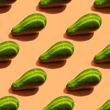 A pattern of ripe green avocado with shadow and stripes from the light 스톡 사진