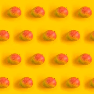 Pattern with ripe mango on yellow background. Top View. Copy Space. Pop art d Stock Photos