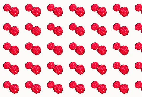 A pattern of ripe raspberries with a shadow on a white background. Berry patt Stock Photos