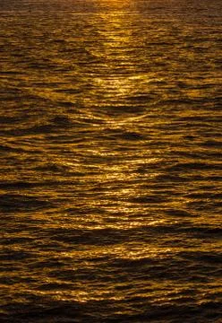 Pattern of ripples in the ocean reflecting sun 스톡 사진