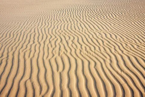 Pattern of ripples in the sand, background Stock Photos