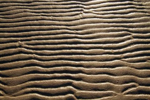 Pattern of ripples in sand of beach Stock Photos