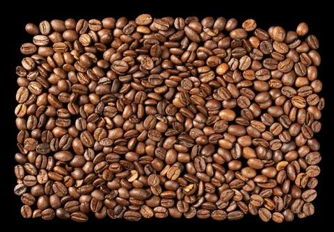 Pattern of roasted Arabica coffee beans, contrasting black background Stock Photos