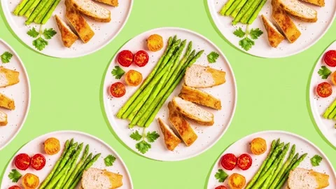 Pattern of roasted chicken breast with asparagus Stock Footage 153166430