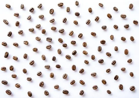 Pattern of roasted coffee beans arrange on white background Stock Photos