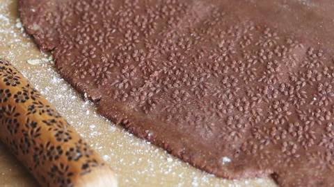 Pattern on rolled dough. Next to it is a rolling pin with a pattern for embos Stock Footage 196983360