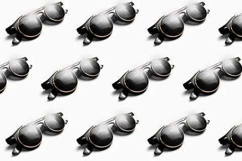 Pattern of round hipster sunglasses on white background. Stock Photos