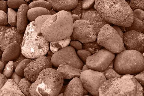 Pattern of rounded volcanic stones in brown color Stock Photos