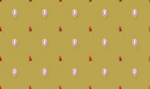 Pattern of rugby balls and red flags on yellow background Stock Illustration