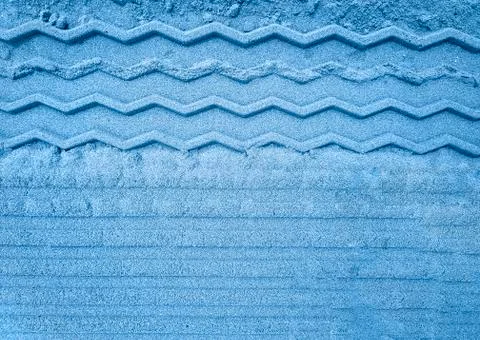 Pattern on sand after track toned in blue Stock Photos