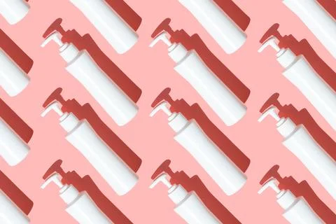 Pattern sanitizer tubes on pink table flatlay. Fabric medical production Foto stock