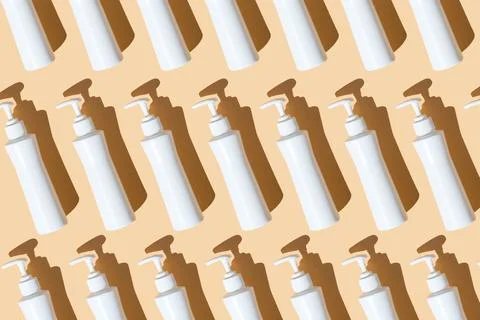 Pattern sanitizer tubes on yellow table flatlay. Fabric medical production Stock Photos