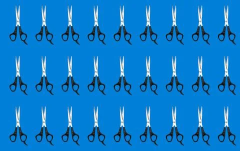 Pattern with scissors on a blue background. Stock Photos