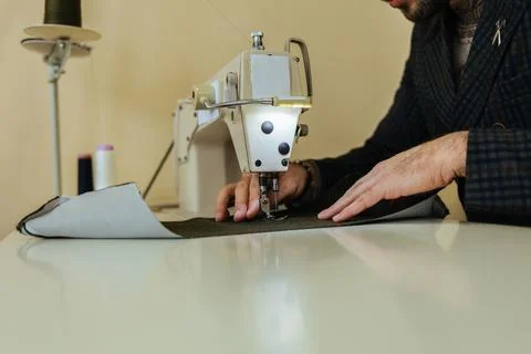 Pattern, scissors, tape measure, and a sewing machine. Workplace of seamstr.. Stock Photos