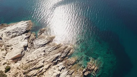 Pattern of sea surface and rocky shore. Thracian Sea, Greece. Rocky coast Stock Footage 111335789
