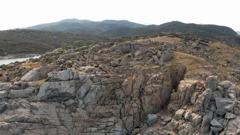 Pattern sea surface and rocky shore. Thracian Sea, Greece. Rocky coast peninsula Stock Footage 111335831