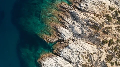 Pattern of sea surface and rocky shore. Thracian Sea, Greece. Rocky coast Stock Footage 111335860