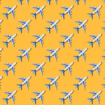 Pattern, seamless model airplane texture, plane on yellow background. Foto stock
