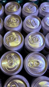 Pattern of silver aluminum beverage can tops with ring pulls. Fotos Stock