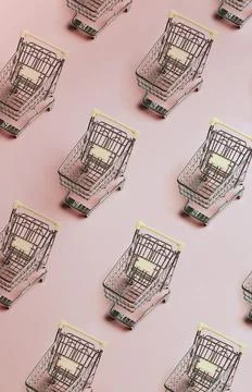 Pattern of silver shopping carts on a pink background Stock Photos