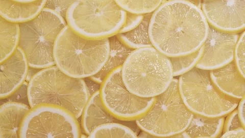 The pattern of sliced lemons is beautifully viewed from top to bottom. juicy Stock Footage 147375686