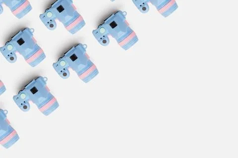 Pattern with SLR camera on pastel color background Stock Photos