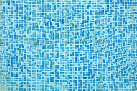 Pattern of small blue and white tiles in harmonic structure like a swimming.. Stock Photos