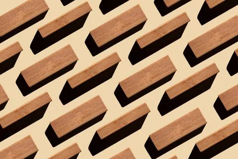 Pattern of small rectangular wooden blocks on beige background. sustainable l Stock Photos