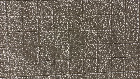 Pattern: small squares covered with white decorative plaster texture background Foto stock