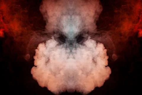 A pattern of smoke resembling a red bird soaring at the top in the form of a  Foto stock