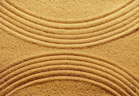Pattern of smooth abstract lines on the summer sand. Stock Photos