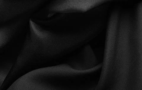 Pattern of Smooth elegant black satin background. 库存照片