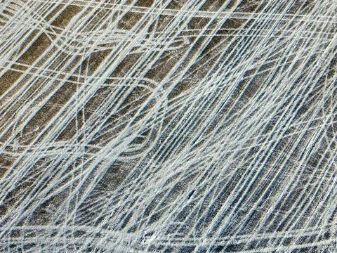 Pattern from snow in winter on a field Stock Photos